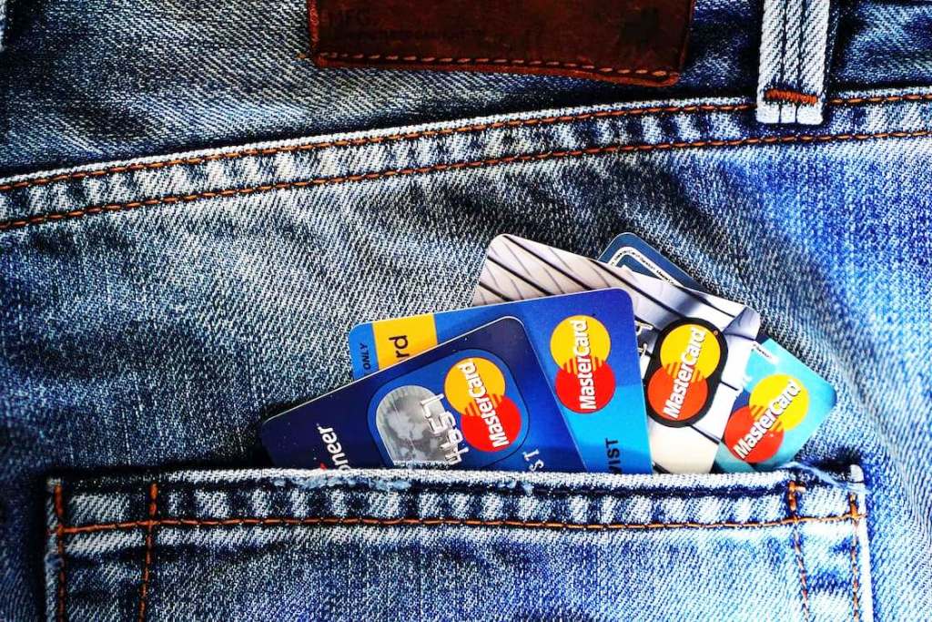 Jean pocket filled with different kinds of credit cards