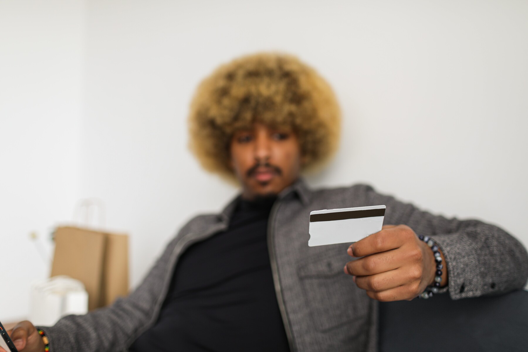 Man looking at a credit card