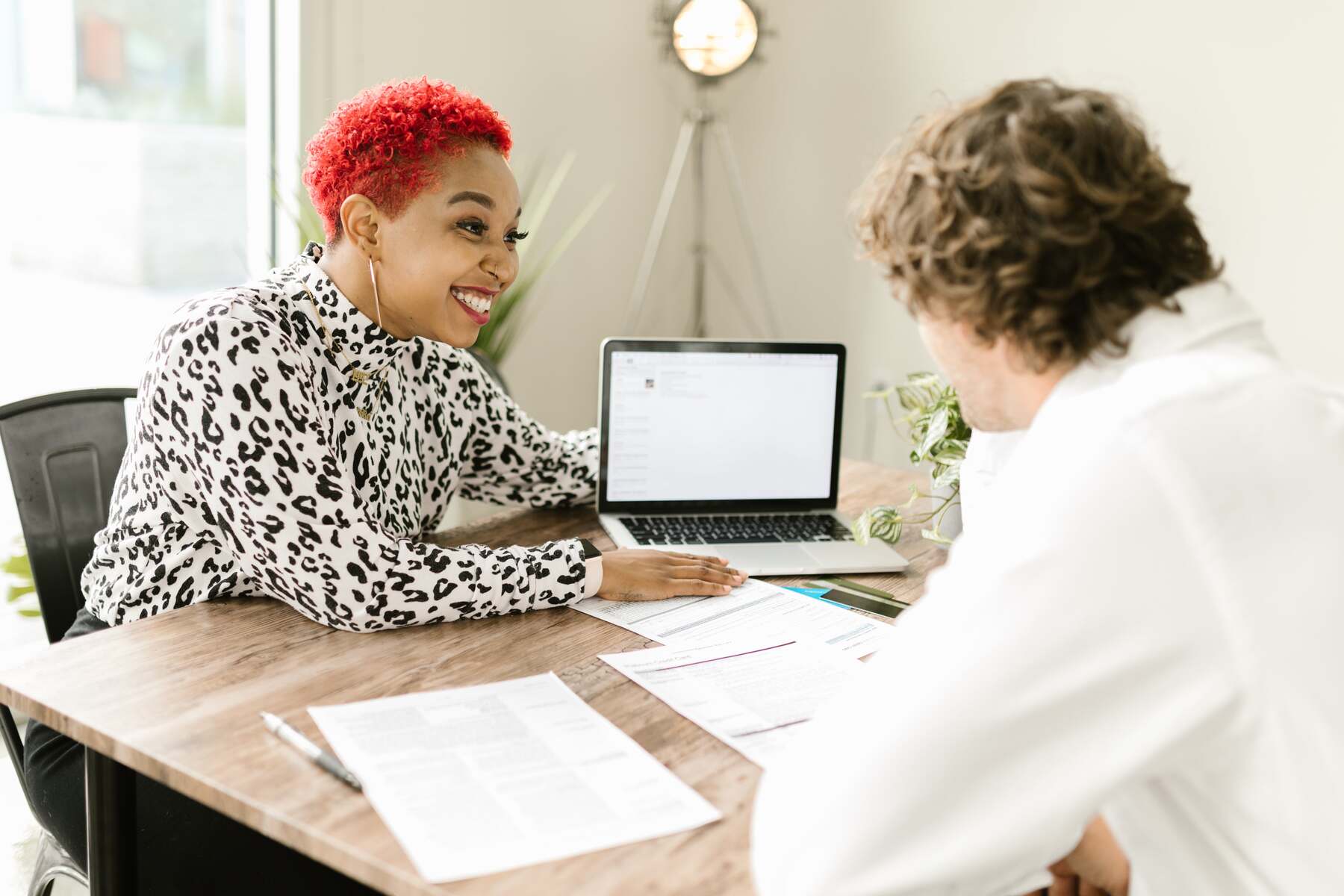 Man consulting with a woman regarding his finances