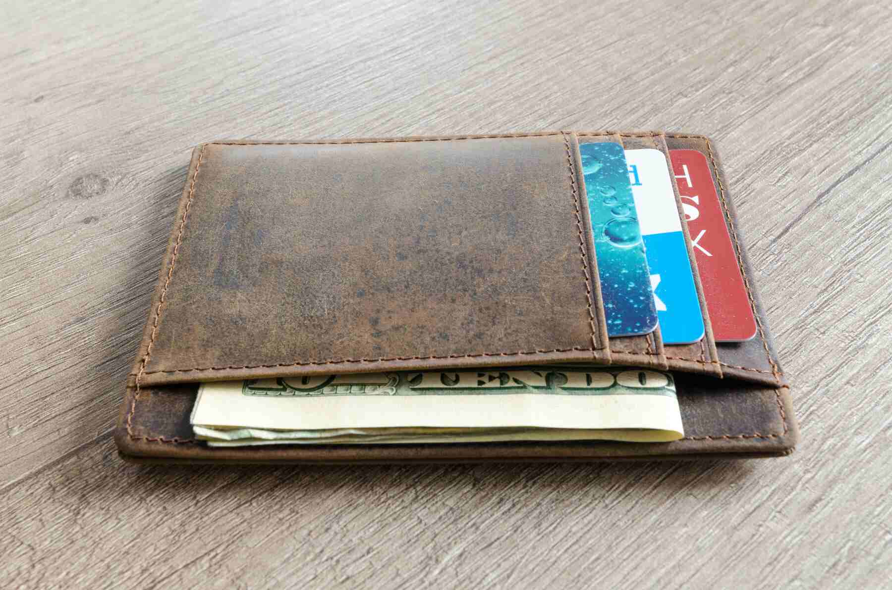 A wallet with different credit cards and money