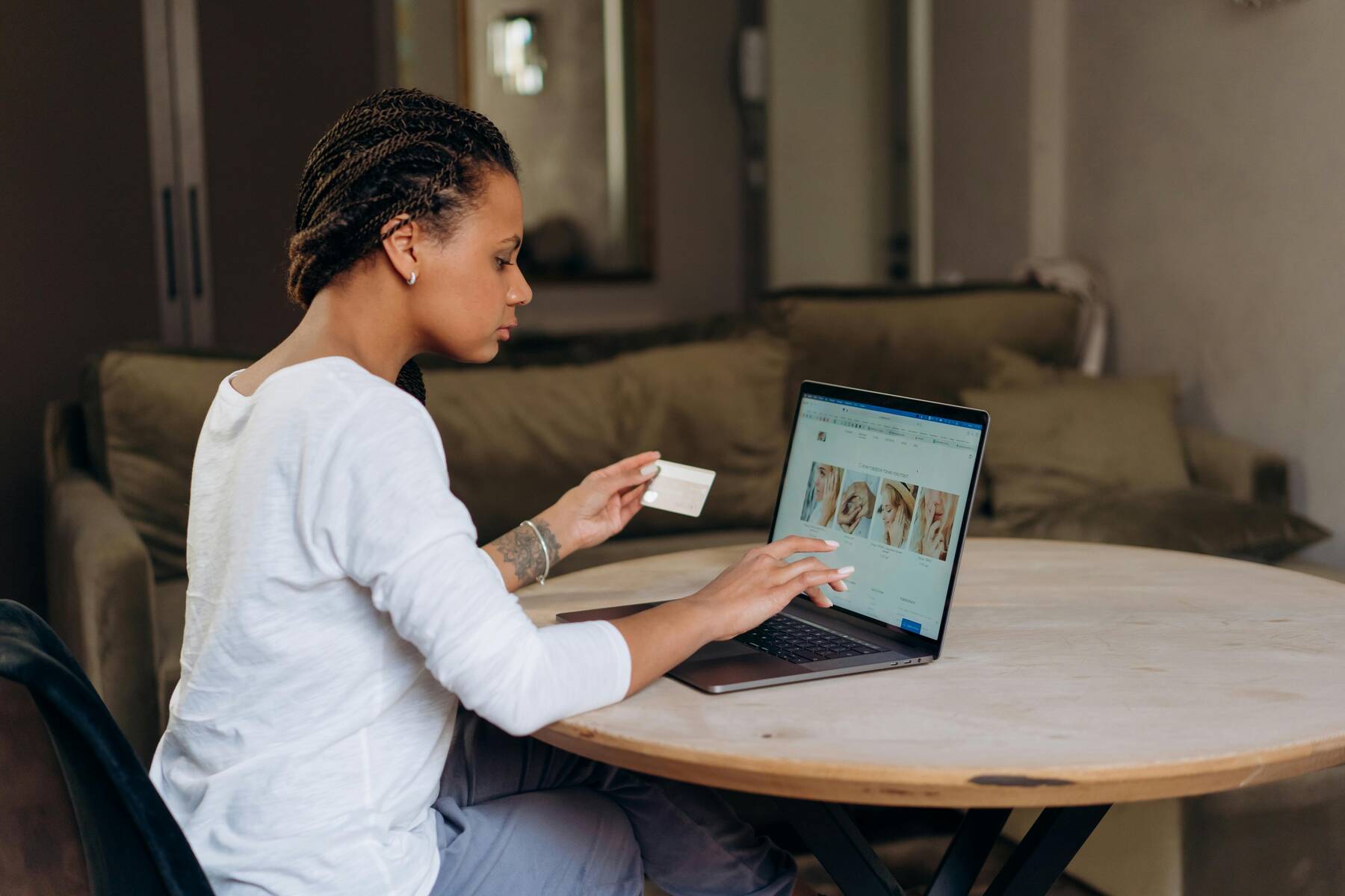 A woman shopping online using her card